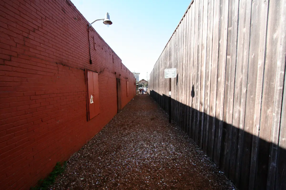 Bottlecap Alley between brick and timber buildings in Northgate, College Station
